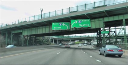 Figure 8.16 - Deficiencies in traffic control devices example: Second set of directional signs (Source: John Campbell, Washington, USA)